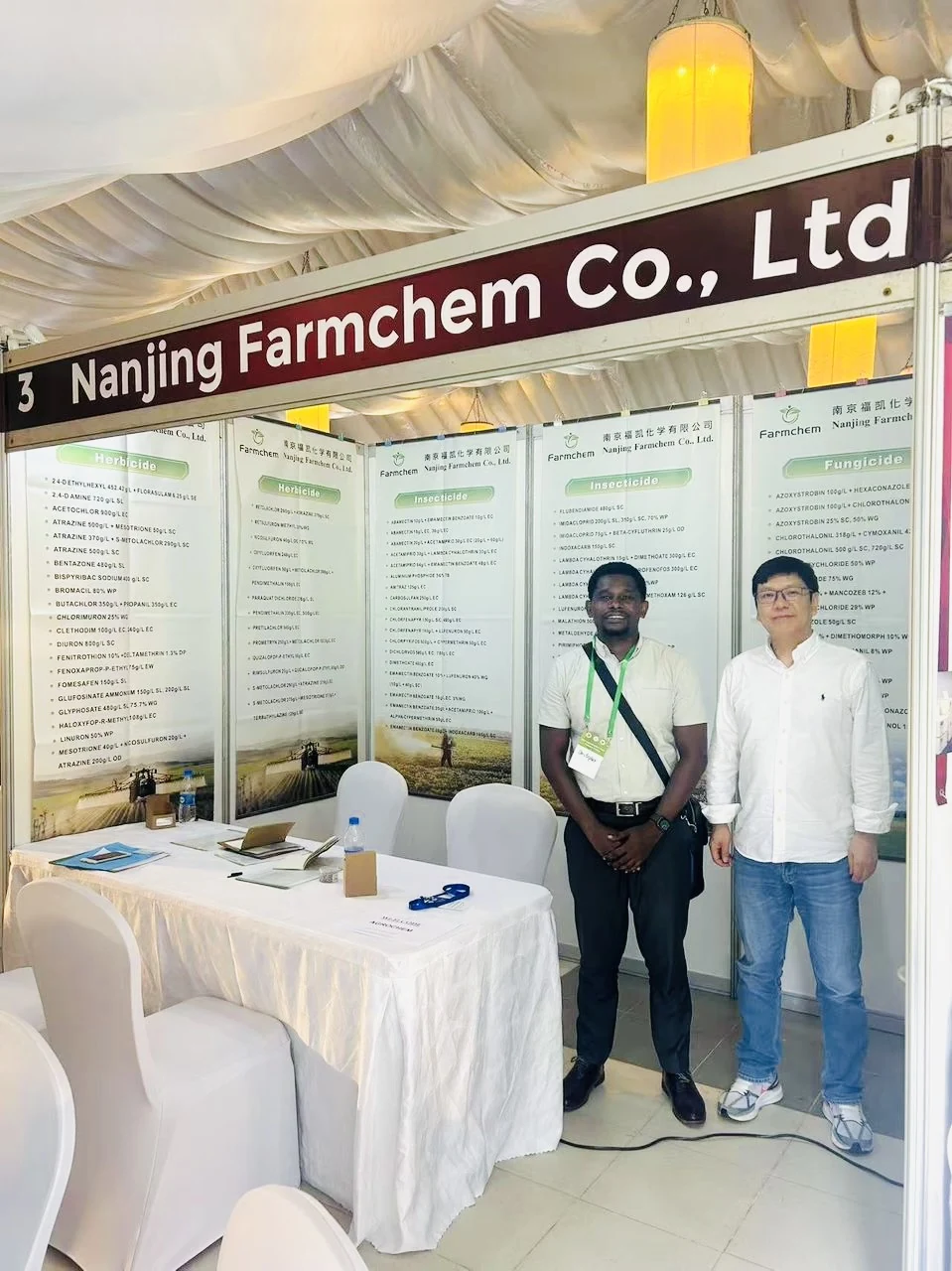 Chris Mbena Agro representative with Nanjing Farmchem representative at a supplier exhibition